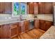 Charming kitchen with stainless steel appliances, wooden cabinets, and granite countertops at 204 Ridge Dr # 12 12-1 12-2, Troy, NC 27371