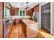 Well-appointed kitchen with wooden cabinets, a large island, and stainless steel appliances at 204 Ridge Dr # 12 12-1 12-2, Troy, NC 27371