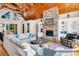 Spacious living room with stone fireplace, wood floors, and ample seating, perfect for entertaining at 204 Ridge Dr # 12 12-1 12-2, Troy, NC 27371