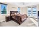 Bright main bedroom with water views, balcony access, and plush carpeting at 204 Ridge Dr # 12 12-1 12-2, Troy, NC 27371