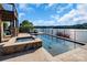 A luxurious pool and spa area with stunning lake views, ideal for summer relaxation at 204 Ridge Dr # 12 12-1 12-2, Troy, NC 27371