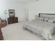 Spacious bedroom with a large bed, cozy armchair, dresser, and plush carpeting at 2061 Argentum Ave # 98, Fort Mill, SC 29707