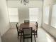 Inviting dining room with large windows providing ample natural light and modern chandelier at 2061 Argentum Ave # 98, Fort Mill, SC 29707