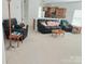 Inviting living room with plush seating, great lighting, and modern design elements at 2061 Argentum Ave # 98, Fort Mill, SC 29707