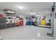 Spacious three car garage with ample storage, tool area, work benches, and epoxy flooring at 2200 Capes Cove Dr, Sherrills Ford, NC 28673