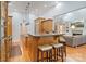 Open kitchen featuring custom island, granite countertops, and hardwood floors at 2200 Capes Cove Dr, Sherrills Ford, NC 28673