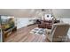 Comfortable living area with wood floors, a plush leather couch, and entertainment setup for relaxation and enjoyment at 2200 Capes Cove Dr, Sherrills Ford, NC 28673