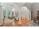 Open-concept living room featuring high ceilings, hardwood floors, and plentiful natural light at 2200 Capes Cove Dr, Sherrills Ford, NC 28673