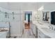 Modern main bathroom with a glass shower, dual vanities, and stylish fixtures at 2200 Capes Cove Dr, Sherrills Ford, NC 28673