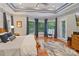 Spacious main bedroom featuring a bay window, hardwood floors, and a comfortable seating area at 2200 Capes Cove Dr, Sherrills Ford, NC 28673