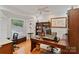 Dedicated home office space with a large desk, custom shelving, and ample natural light at 2200 Capes Cove Dr, Sherrills Ford, NC 28673