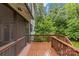 Spacious wooden deck with screened porch overlooking the backyard and mature trees at 2414 Bay St, Charlotte, NC 28205