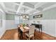 Elegant dining room with coffered ceiling and modern chandelier at 2414 Bay St, Charlotte, NC 28205