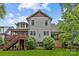 Exterior of the two-story home featuring a wooden deck and a well-manicured lawn at 2414 Bay St, Charlotte, NC 28205