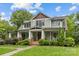 Charming two-story home with a beautiful front porch and manicured landscaping at 2414 Bay St, Charlotte, NC 28205