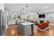 Open kitchen featuring a gray island with a white countertop, stainless appliances, and hardwood floors at 2414 Bay St, Charlotte, NC 28205