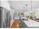 Bright kitchen with stainless steel appliances, a large island, and white subway tile backsplash at 2414 Bay St, Charlotte, NC 28205