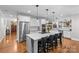 Modern kitchen with a large island, stainless steel appliances, white cabinets, and hardwood flooring at 2414 Bay St, Charlotte, NC 28205