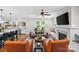 Open concept living room with fireplace, hardwood floors, and kitchen island with seating at 2414 Bay St, Charlotte, NC 28205
