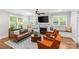 Inviting living room with fireplace, hardwood floors, large windows, and comfortable seating area at 2414 Bay St, Charlotte, NC 28205