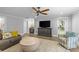 Inviting living room with lots of comfortable seating, a TV, a wet bar, and natural light at 2414 Bay St, Charlotte, NC 28205