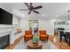 Inviting living room featuring a fireplace, ceiling fan, wood floors, and patio access at 2414 Bay St, Charlotte, NC 28205