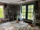 Bedroom that is prepped for renovation with lots of windows at 273 E Main Ave, Taylorsville, NC 28681