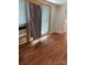 Bedroom featuring hardwood floors, curtains, and neutral wall color at 273 E Main Ave, Taylorsville, NC 28681