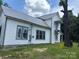 Exterior side-view showcasing the home's structure and siding at 273 E Main Ave, Taylorsville, NC 28681
