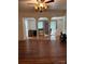 Living room showcasing hardwood floors and decorative columns creating an open feel at 273 E Main Ave, Taylorsville, NC 28681