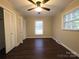 Bright bedroom features a ceiling fan, wood flooring and double closets at 3316 Mckee Rd, Charlotte, NC 28270