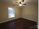 This bedroom features a neutral color scheme and a window that provides natural light at 3316 Mckee Rd, Charlotte, NC 28270