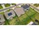 The aerial view displays houses with green lawns, solar panels, fenced backyards, and outdoor features at 4046 Starfire Ln, Rock Hill, SC 29732