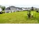 Expansive backyard with lush green lawn, enclosed with black fencing, ideal for outdoor activities at 4046 Starfire Ln, Rock Hill, SC 29732