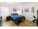 Cozy bedroom featuring hardwood floors, a comfortable bed, and a bright window at 4046 Starfire Ln, Rock Hill, SC 29732