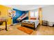 Stylish bedroom with an indoor basketball game and sleek wood floors and matching metal frame bed at 4046 Starfire Ln, Rock Hill, SC 29732