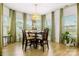 Bright dining room with modern light fixture, stylish table setting, and window views at 4046 Starfire Ln, Rock Hill, SC 29732