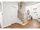 Entryway with staircase, wood floors, and contemporary decor providing a welcoming ambiance at 4046 Starfire Ln, Rock Hill, SC 29732
