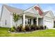 Inviting front porch with manicured landscaping and decorative hanging plants creating curb appeal at 4046 Starfire Ln, Rock Hill, SC 29732