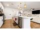 Contemporary kitchen with stainless appliances, a breakfast bar, and view into adjacent living space at 4046 Starfire Ln, Rock Hill, SC 29732