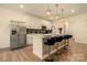 Modern kitchen featuring stainless steel appliances, a breakfast bar with seating, and stylish pendant lights at 4046 Starfire Ln, Rock Hill, SC 29732