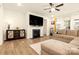 Cozy living room with a fireplace, mounted TV, plush seating, and natural light from windows at 4046 Starfire Ln, Rock Hill, SC 29732