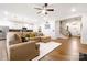Open concept living space featuring hardwood floors, modern lighting, and a spacious sectional sofa at 4046 Starfire Ln, Rock Hill, SC 29732