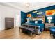 Spacious main bedroom featuring a blue accent wall, modern decor, and hardwood floors at 4046 Starfire Ln, Rock Hill, SC 29732