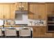 Well-appointed kitchen featuring modern cabinetry, stainless steel appliances, and a breakfast bar at 4209 Pinekirk Dr # 374, Charlotte, NC 28269
