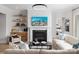 Bright living room featuring a modern fireplace, stylish furniture, and decorative shelving at 4209 Pinekirk Dr # 374, Charlotte, NC 28269