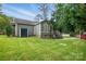 Residential backyard with shed, wooden deck, and well-maintained lawn, offering great outdoor living space at 4235 Howie Cir, Charlotte, NC 28205