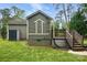 Exterior view of a backyard featuring a shed, wooden deck with stairs, and well-manicured lawn space at 4235 Howie Cir, Charlotte, NC 28205