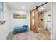 Well-lit bathroom with a sliding door shower, bench, and a modern design at 4235 Howie Cir, Charlotte, NC 28205