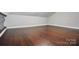A finished bonus room with hardwood floors and a neutral paint at 4235 Howie Cir, Charlotte, NC 28205